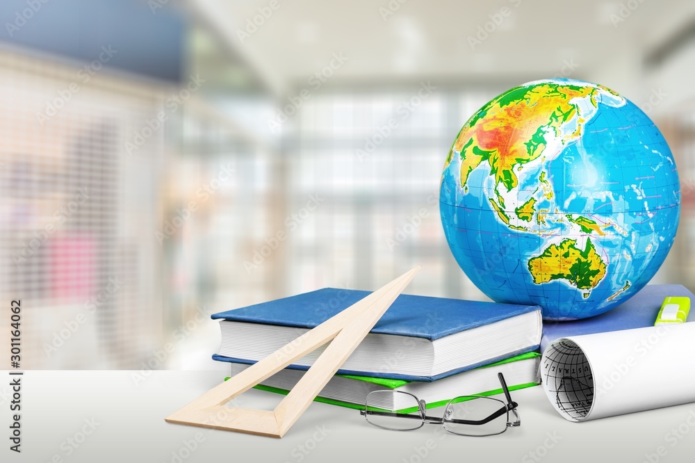 School Backpack with stationery on wooden table