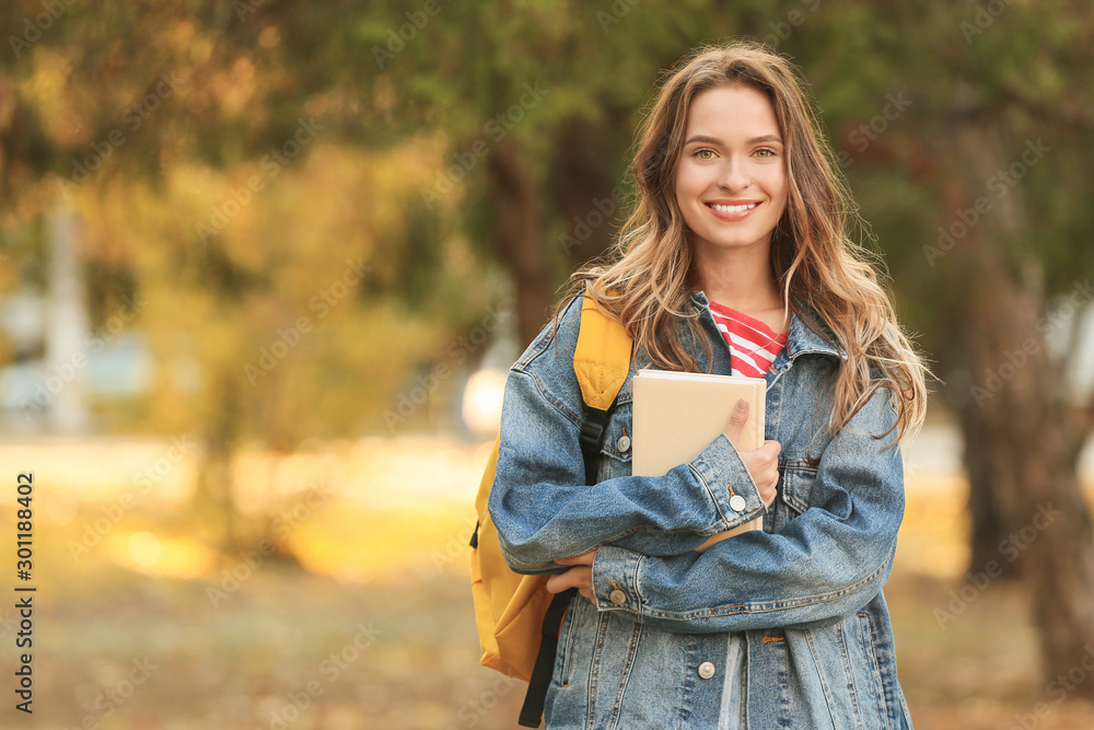 Portrait of teenage female student outdoors