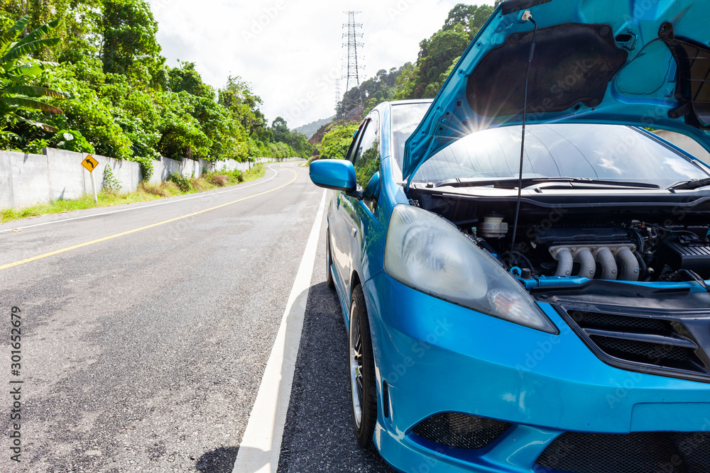 Car on the road with engine malfunction car in the middle of the road