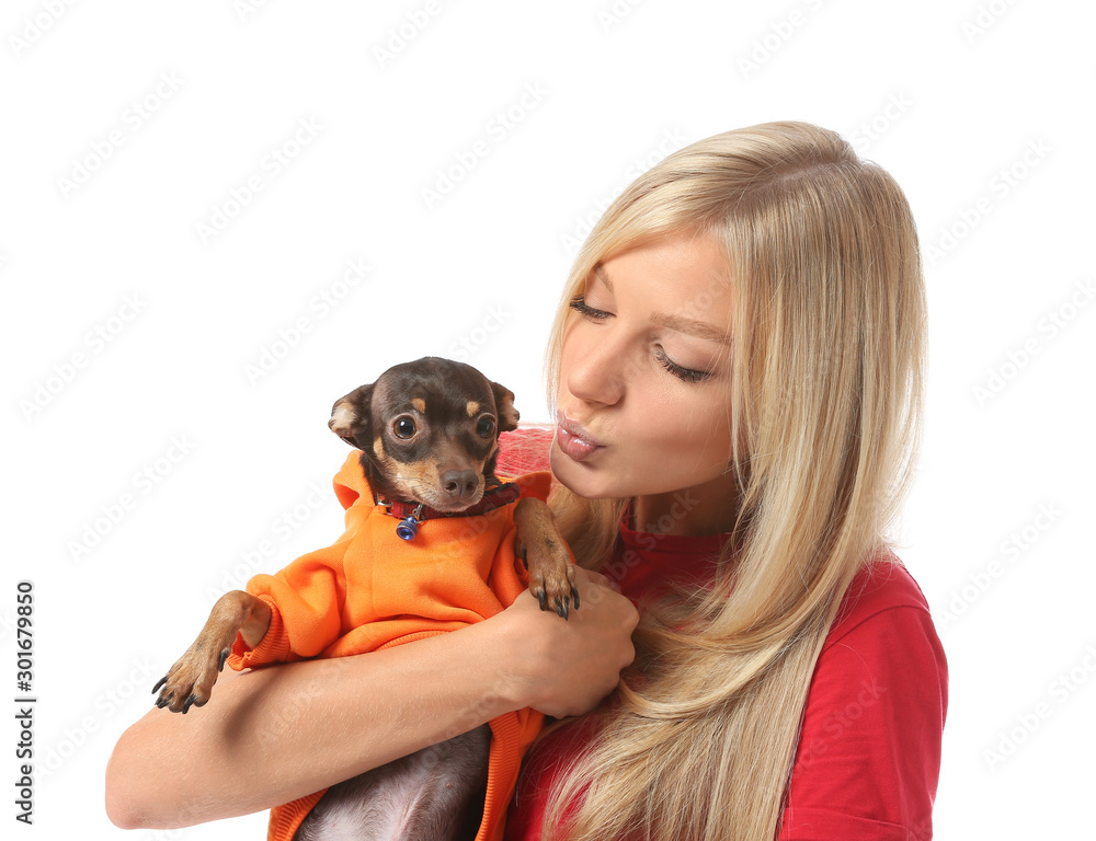 Beautiful young woman with cute toy terrier dog on white background