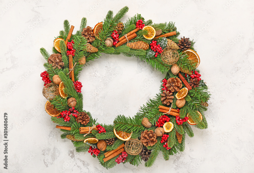 Beautiful Christmas wreath on light background