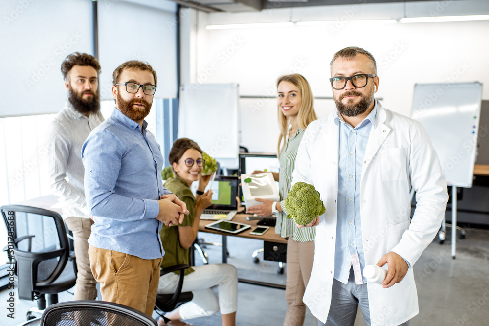 Portrait of a team working on the packaging design of a new eco product in the office. Branding and 