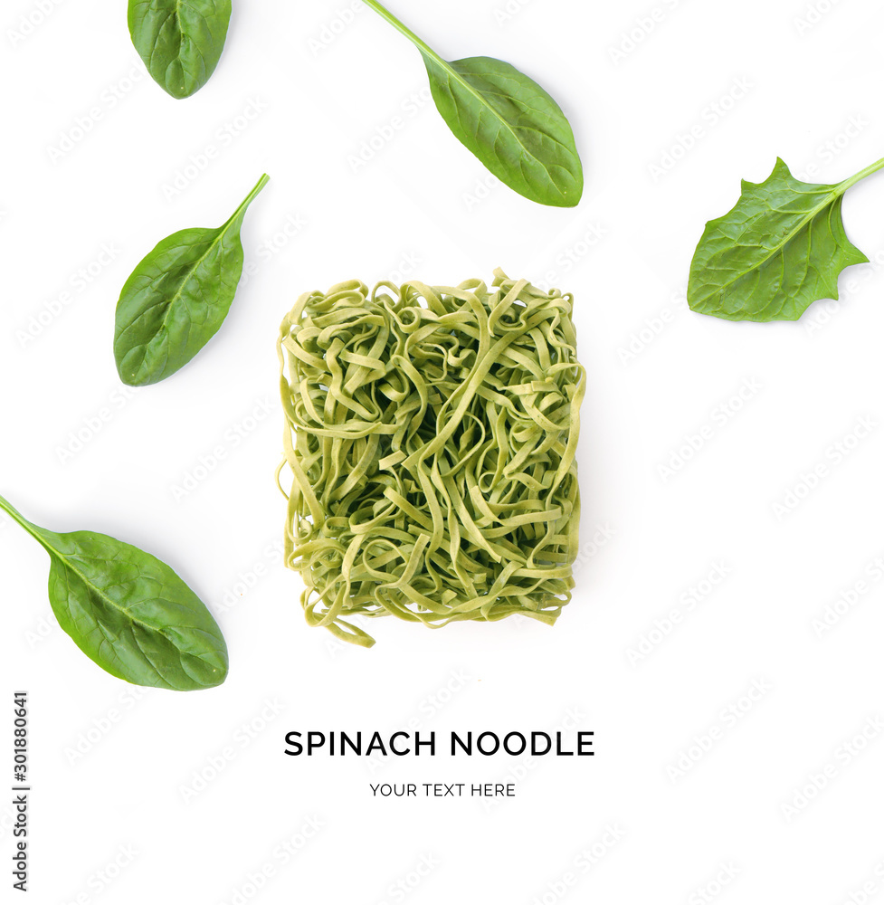 Creative layout made of spinach and spinach noodles on white background. Flat lay. Food concept. Mac