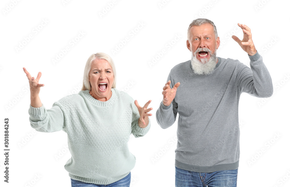 Angry mature couple on white background