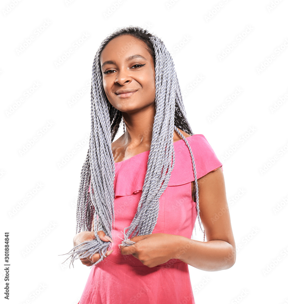 Beautiful young African-American woman on white background