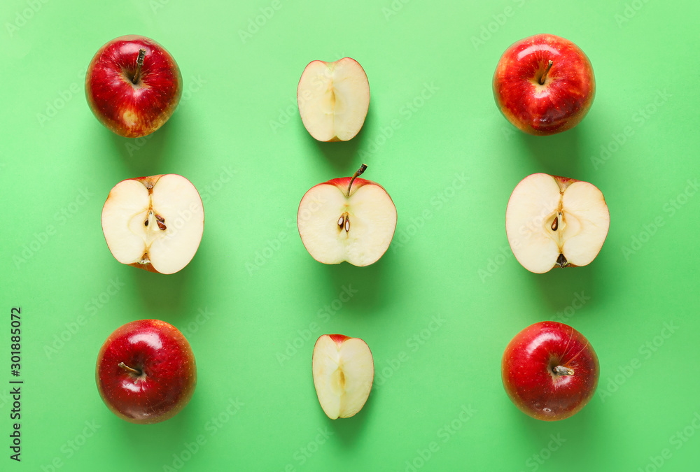 Fresh ripe apples on color background