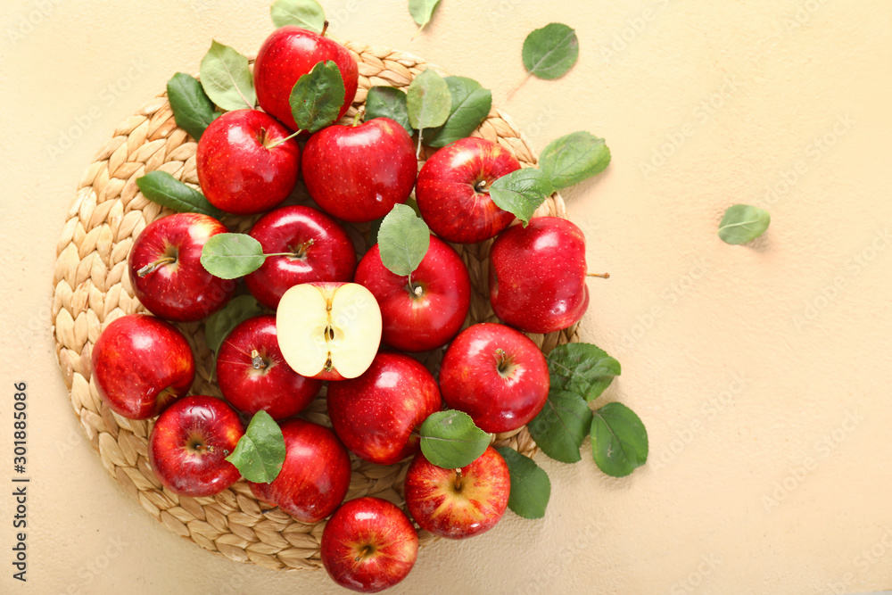 Fresh ripe apples on color background