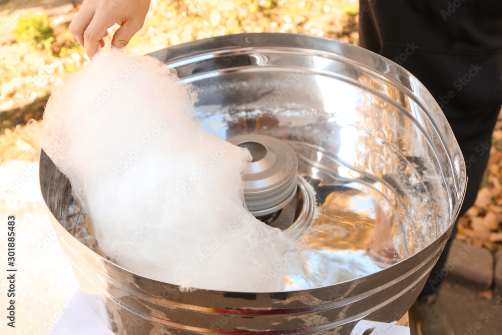 Making of sweet cotton candy outdoors, closeup