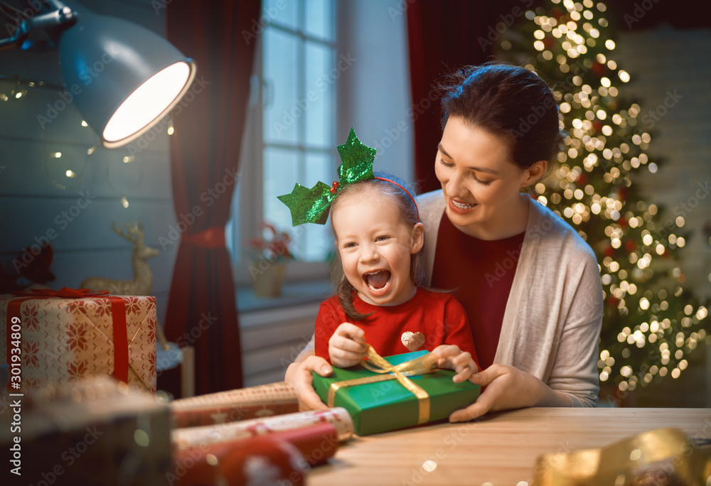 Mother and child packing gifts