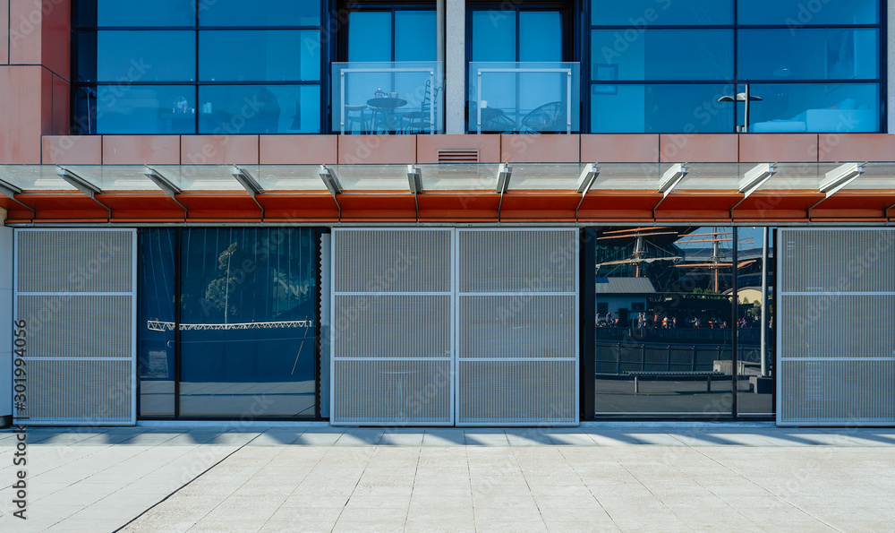 Empty brick road with office building