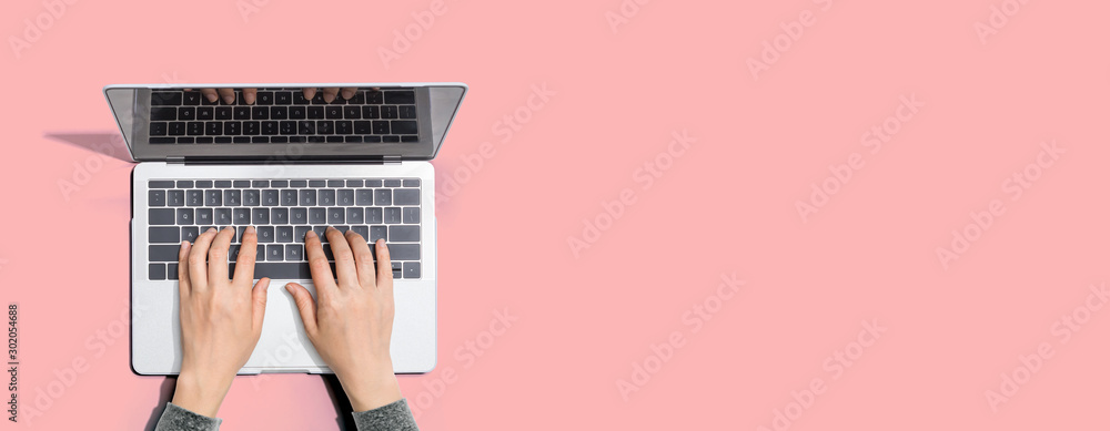 Person using a laptop computer from above