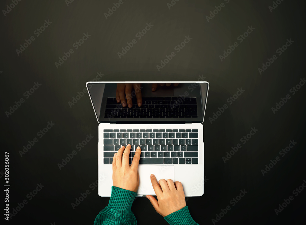 Person using a laptop computer from above