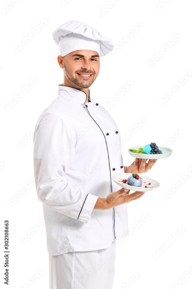 Male confectioner with tasty desserts on white background