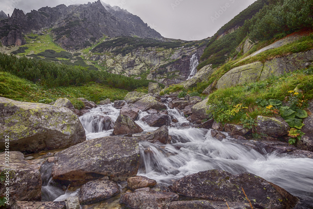 Mountain river flowing through the stones.