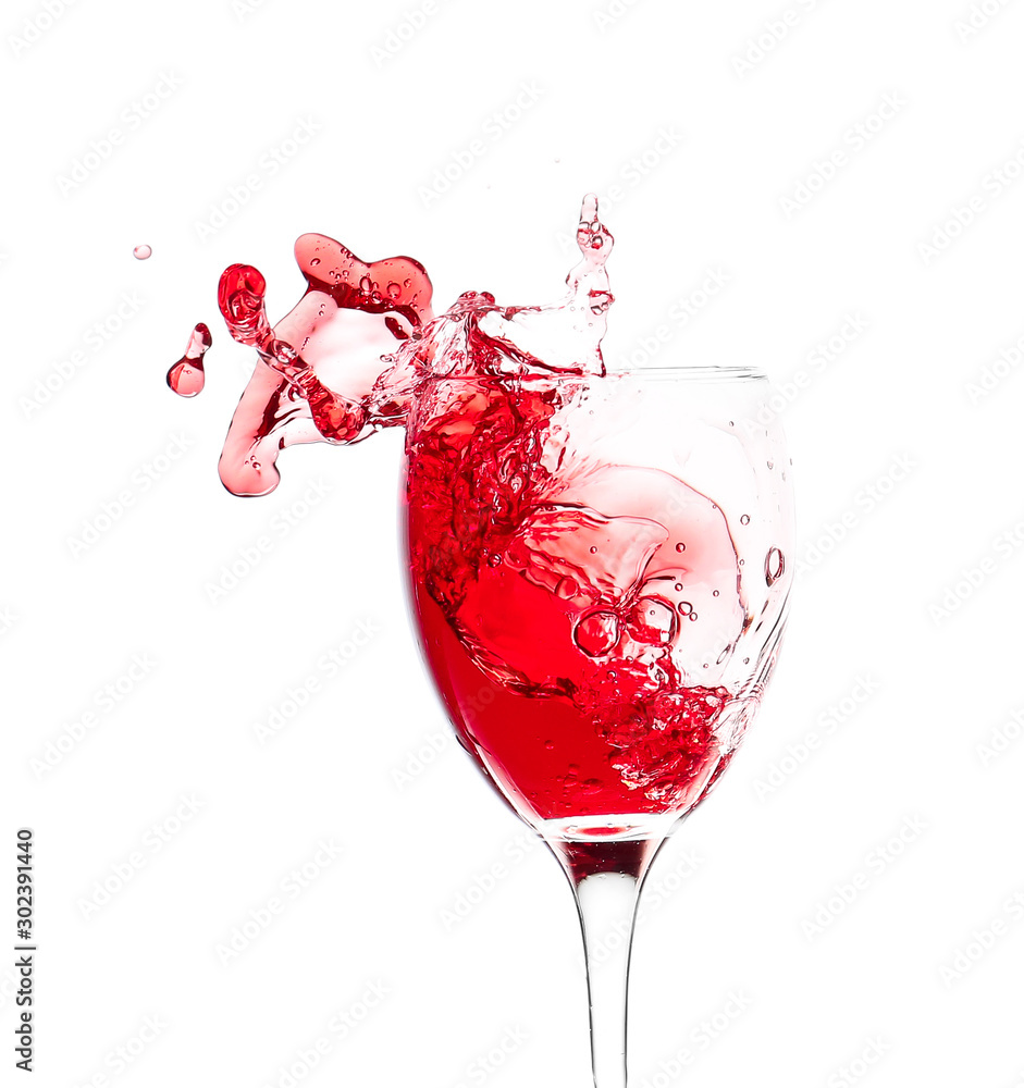 Glass of wine with splash on white background