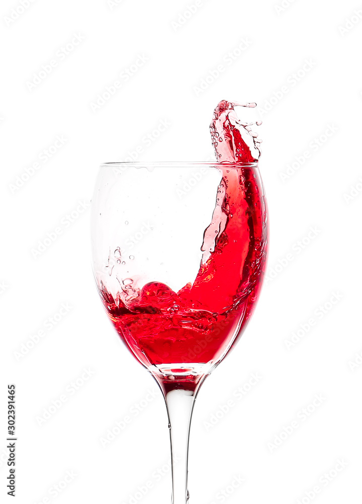 Glass of wine with splash on white background