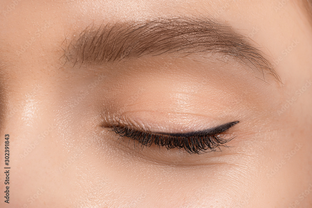 Young woman with beautiful eyebrows, closeup