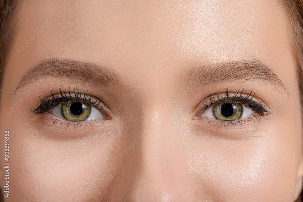 Young woman with beautiful eyebrows, closeup