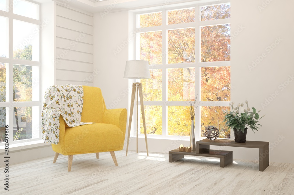 White stylish minimalist room with armchair and autumn landscape in window. Scandinavian interior de