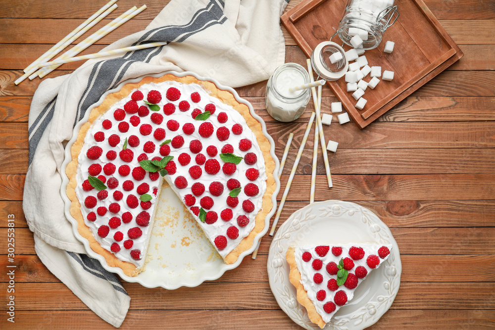 Tasty raspberry pie on wooden background