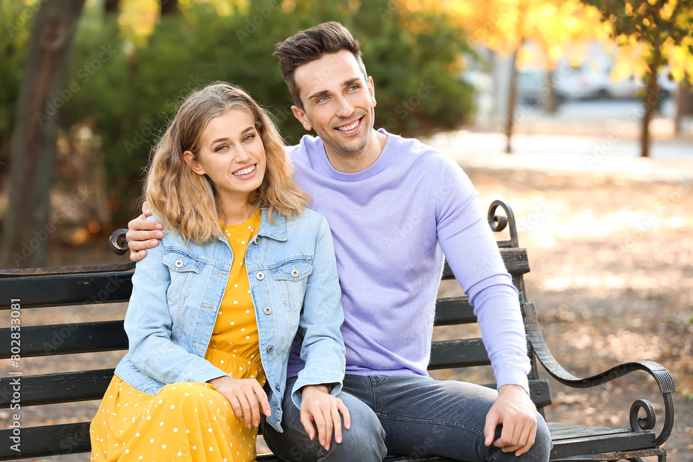 Happy young couple on romantic date in park