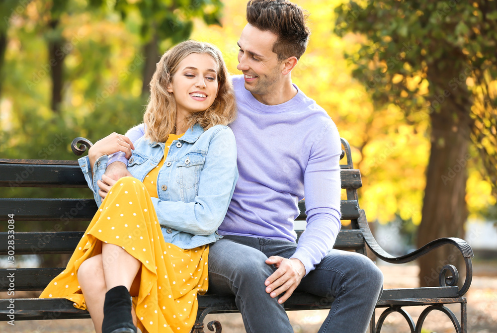 Happy young couple on romantic date in park