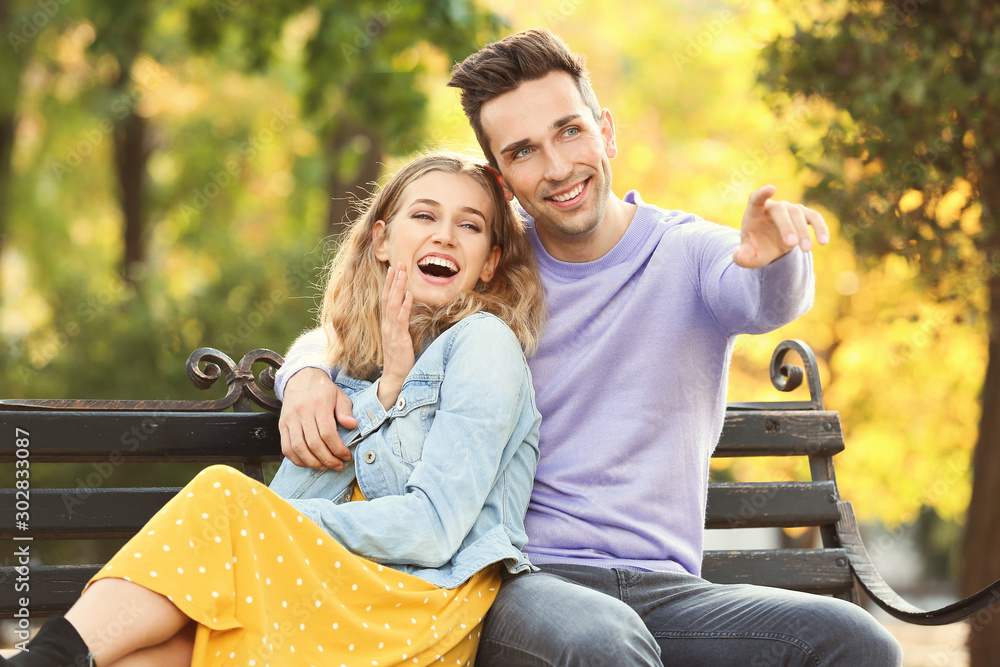 Happy young couple on romantic date in park