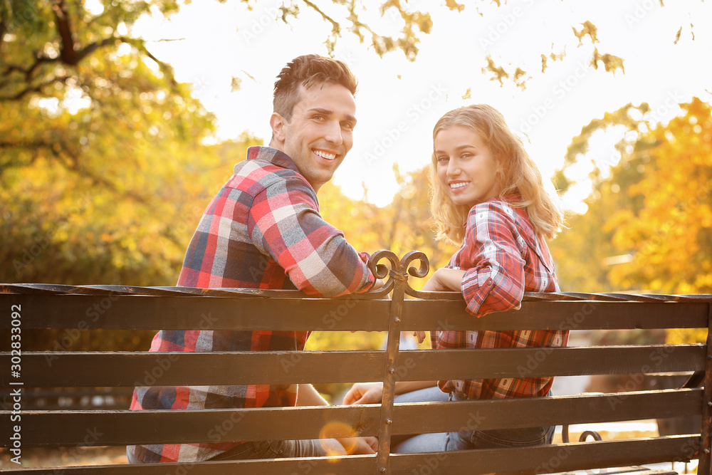 Happy young couple on romantic date in park