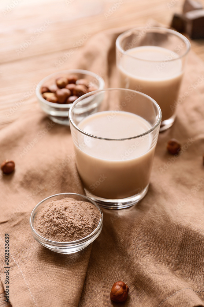 Glasses of protein shake on table