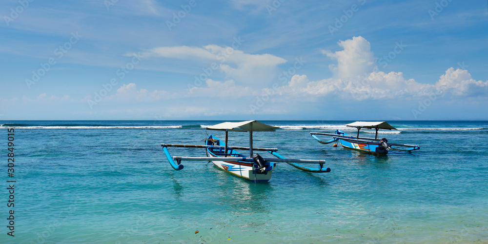  boat on white sand beach in bali -indonesia