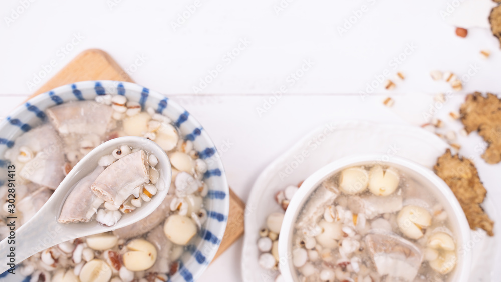 Tasty Four Tonics Herb Flavor Soup, Taiwanese traditional food with herbs, pork intestines on white 