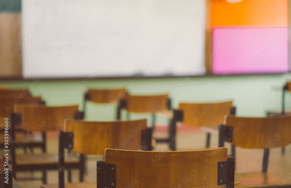 Lecture room or Examination room.School empty classroom with desks and chair for studying lessons an