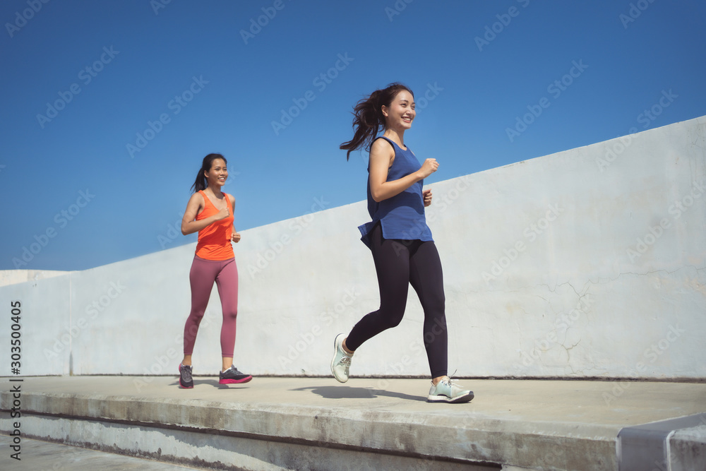 Asian friends group jogging in the morning