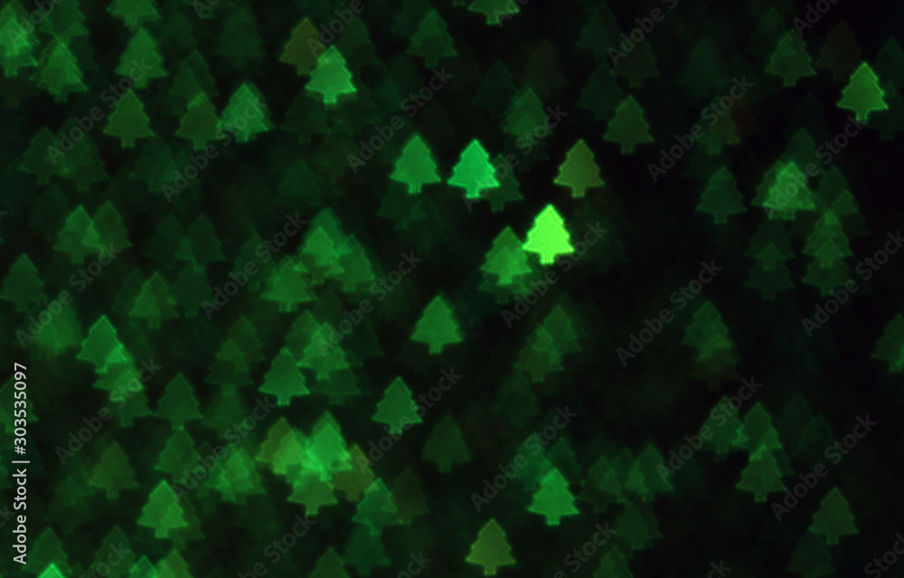 Christmas tree green light  blurred background.