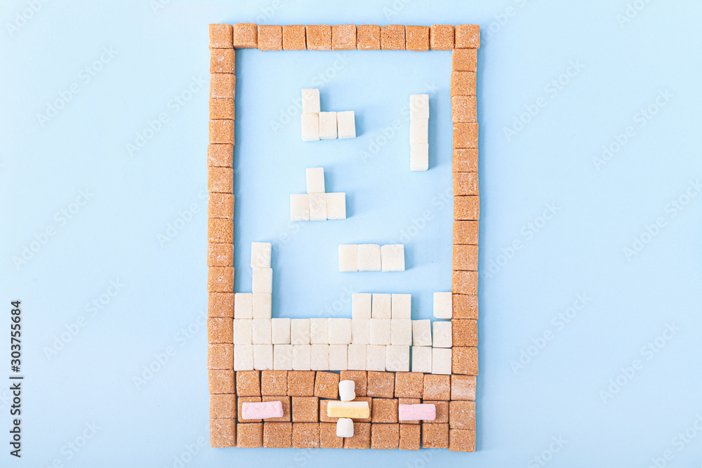 Composition made of sugar cubes on color background