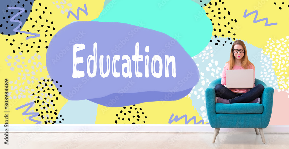 Education concept with young woman using her laptop in a chair