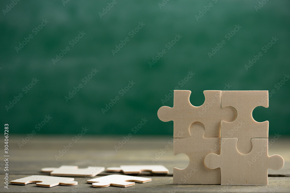 Creative solution for idea - business concept, jigsaw puzzle on the blackboard