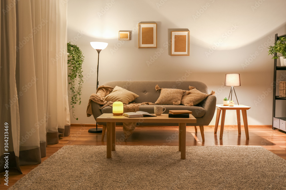 Stylish interior of living room at night