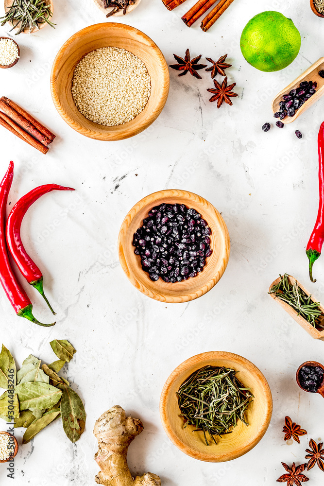 Cooking with spices, salt and pepper on kitchen table background top view