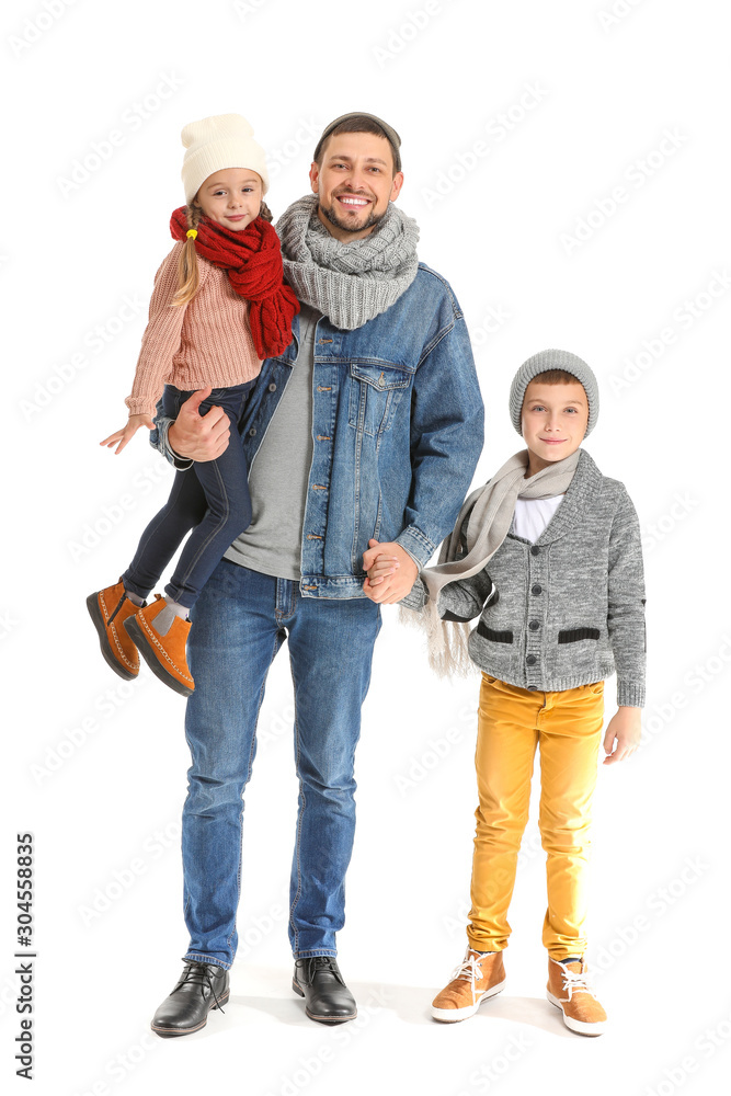 Portrait of happy family in autumn clothes on white background