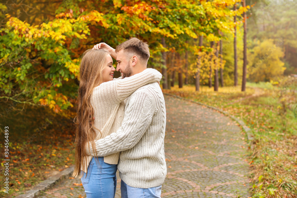 Loving young couple in autumn park