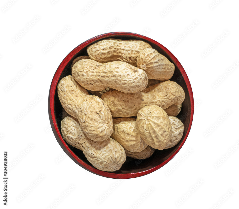 Groundnut or peanut in the wooden red bowl isolated on white background.Top view and close up. Take 