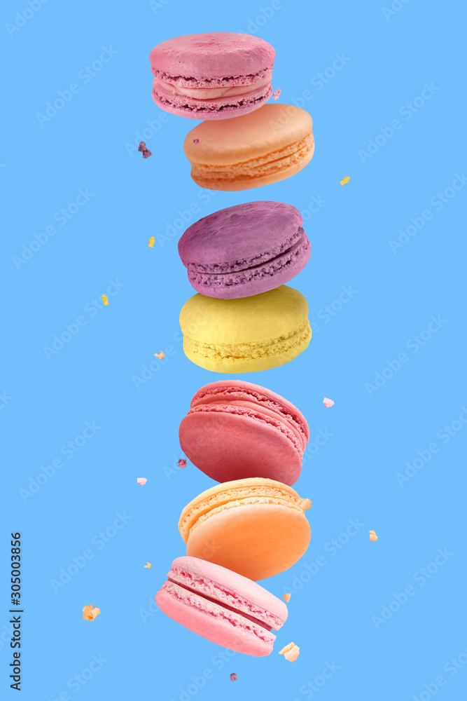 Tasty colorful macarons on white background