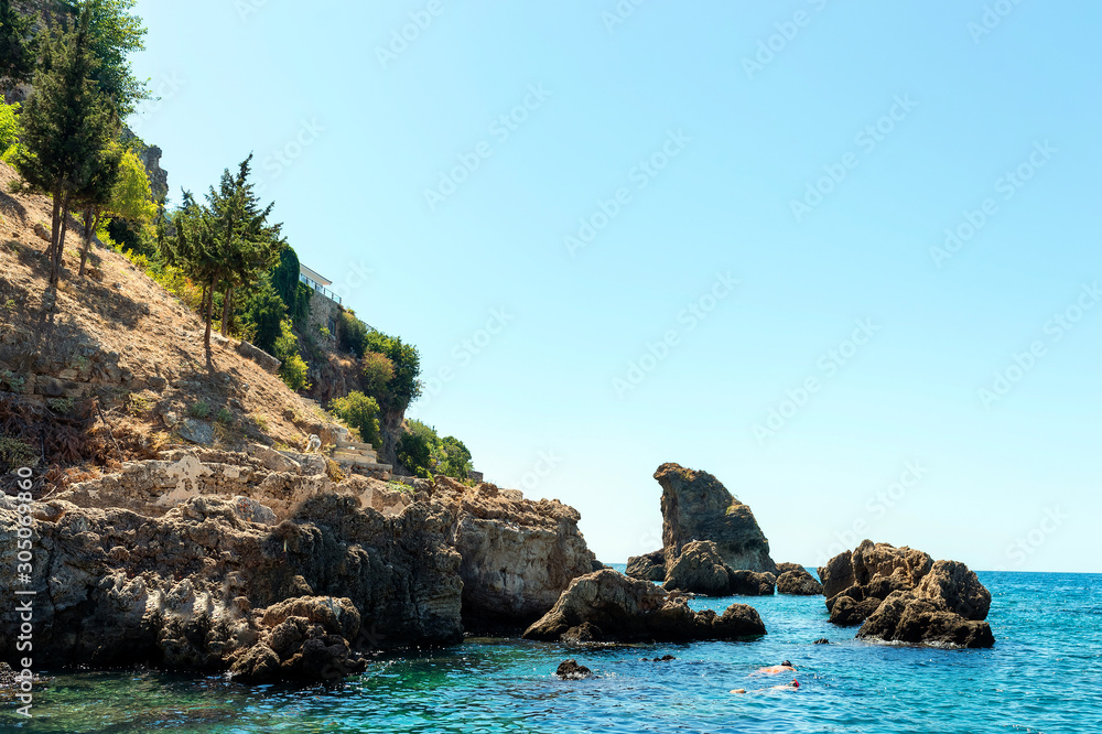 The mountains and sea scenery with blue sky, beautiful nature. Summer time. Vocation concept. Select