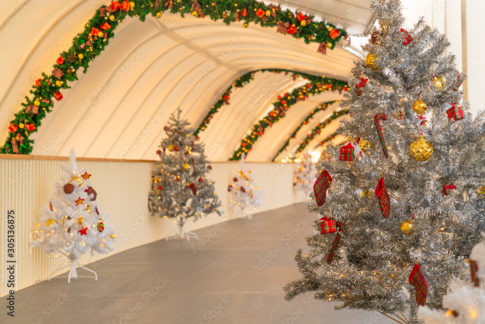 Christmas tree decoration along walkway in city center in Christmas festival of December 2019.