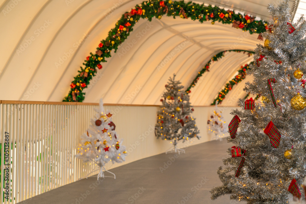 Christmas tree decoration along walkway in city center in Christmas festival of December 2019.