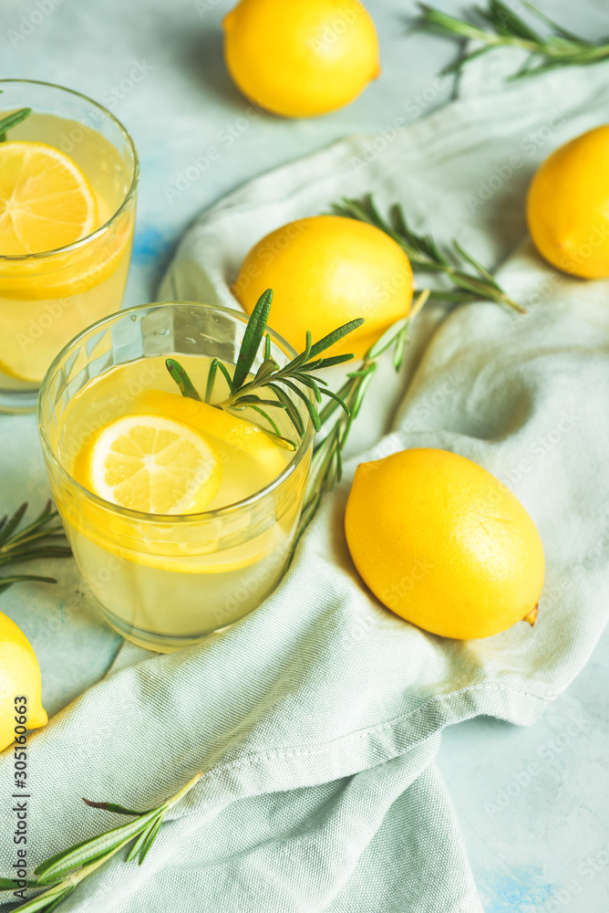 Glasses of fresh lemonade on table