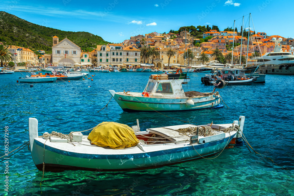 Beautiful harbor with fishing boats and historic buildings, Hvar, Croatia