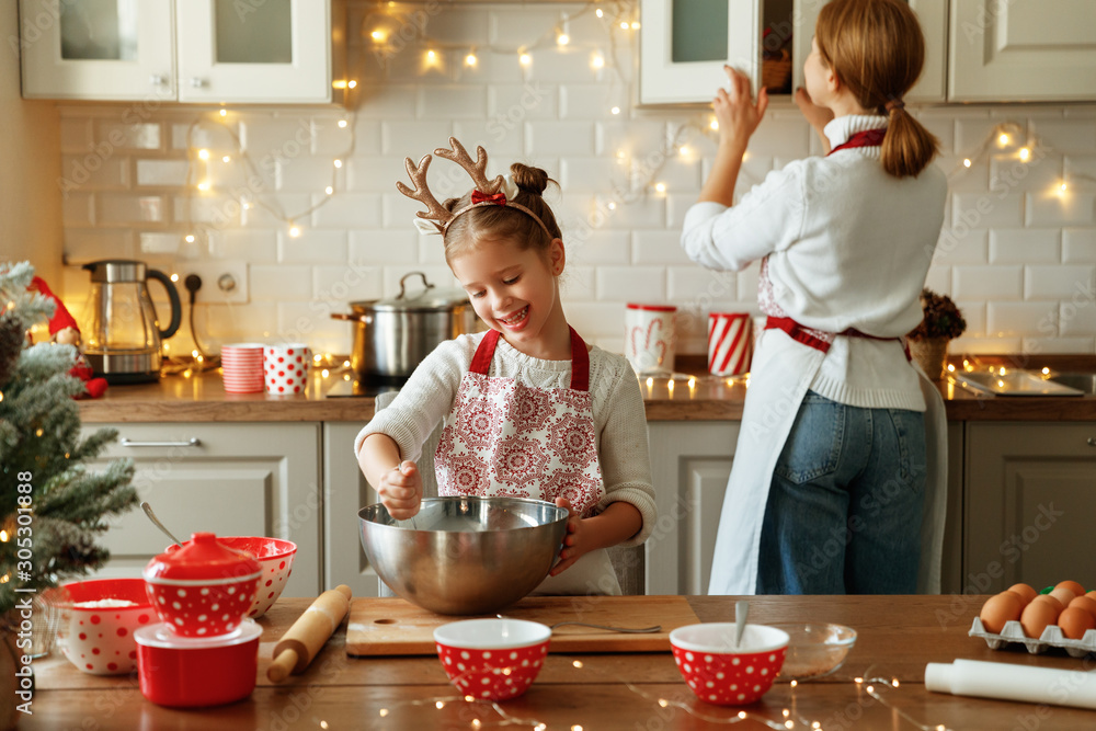 happy family mother and child bake christmas cookies.