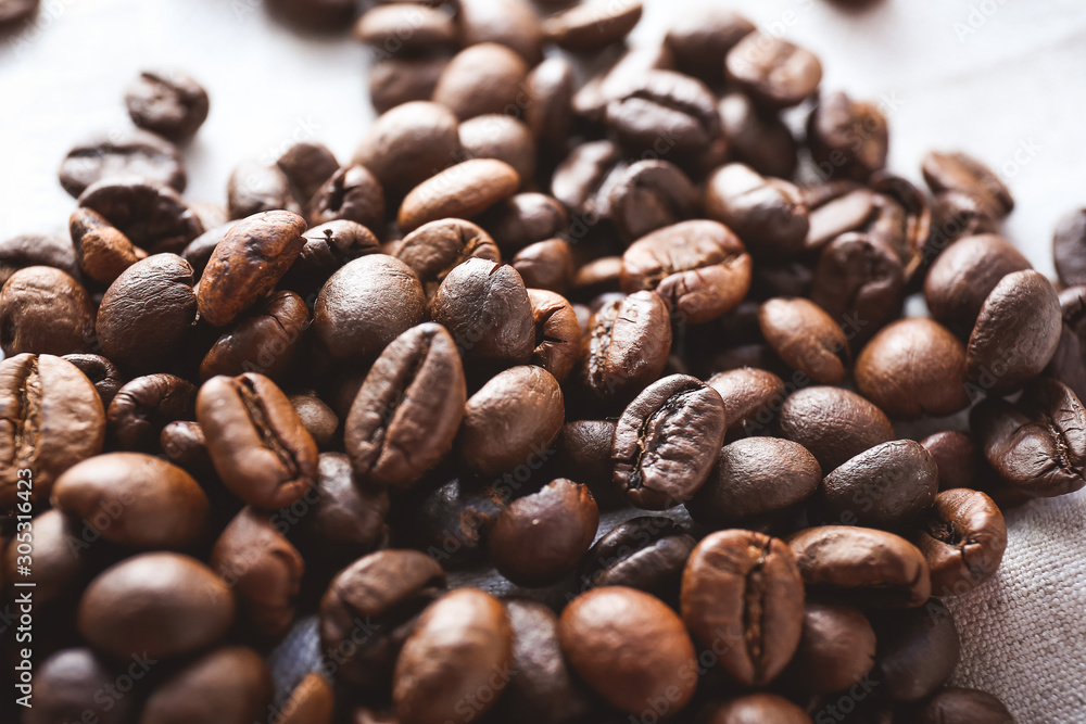 Heap of roasted coffee beans, closeup